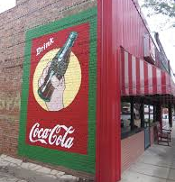 Coca-Cola picture painted on side of brick building in Atlantic, Iowa