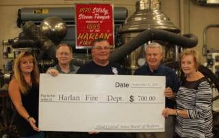 The West Central Iowa Regional Board of REALTORS donated $700 recently to the Harlan Fire Department. The donation will help with updating and maintaining the department’s fire equipment. This donation is a joint effort between the local council and the REALTOR Foundation of Iowa. Every year the Iowa REALTOR Foundation contributes thousands of dollars to affordable housing programs, scholarships for bright, young Iowans and promotes other programs across the state that keeps Iowa an attractive place to live. Presenting the donation to Fire Chief Roger Bissen, center, are Vickie Errett, TERRY KNAPP REAL ESTATE; Randy Ouren, OUREN REAL ESTATE; Terry Knapp, TERRY KNAPP REAL ESTATE; and Judy Knapp, TERRY KNAPP REAL ESTATE.