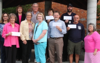 Shenandoah REALTORS® presented checks to the Shenandoah Education Foundation, the Shenandoah Food Pantry, the Shenandoah Historical Society, the Shenandoah Fire Department and the Shenandoah Ambulance Service. Pictured are: REALTOR® Shawn Munsinger, REALTOR® Janell McIntyre, Corby Fichter of the Shenandoah Education Foundation, Jeanine Liljedahl of the Shenandoah Food Pantry, Kevin Livengood, Sally Brownlee, Jane Connell, Lillian Irvin and REALTOR® Joan Schebaum of the Shenandoah Historical Society, Ty Davidson of the Shenandoah Ambulance Service and Ron Biggers of the Shenandoah Fire Department.